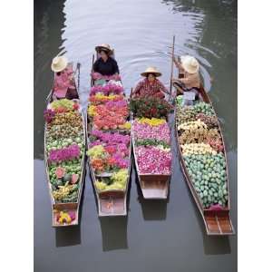 A Group of Four Women Market Traders in Boats Laden with 