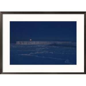  The moon rises over an iceberg in the Bellingshausen Sea 