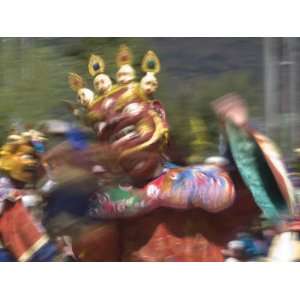 Traditionally Dressed Dancer at the Paro Tsechu, a Religious Dance 
