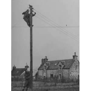  Workers Installing Power Lines to Provide Electricity to 