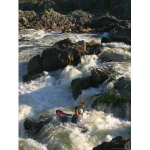  A Kayaker Strokes Hard off a Drop in the Great Falls of 