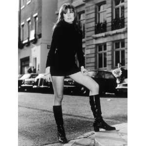 Wearing a Black Polo  Neck Mini Dress and Black Knee High Patent Boots 