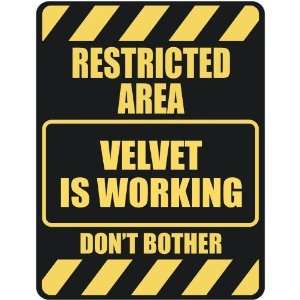   RESTRICTED AREA VELVET IS WORKING  PARKING SIGN