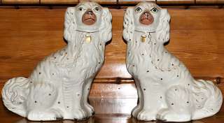 Pair of white Staffordshire dogs  