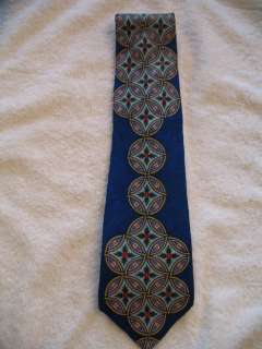 Rush Limbaugh tie   large circle & leaf pattern on dark blue base 