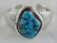Sterling Silver Navajo bracelet with a large light blue/green natural 