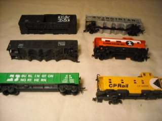 UP FOR AUCTION ARE (6) HO RAIL CARS. SOLD AS IS, FOR PARTS. (3 