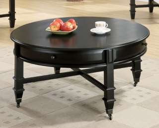   this updated traditional style round coffee table features casters on